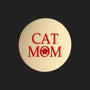 A round, brushed gold metal sticker featuring the text 'CAT MOM' in red, with the letter 'O' replaced by a red paw print icon, shown on a plain white background.