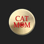 A round, brushed gold metal sticker featuring the text 'CAT MOM' in red, with the letter 'O' replaced by a red paw print icon, shown on a plain white background.
