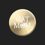 A round, brushed gold metal sticker featuring the text 'CAT MOM' in white, with the letter 'O' replaced by a white paw print icon, shown on a plain white background.