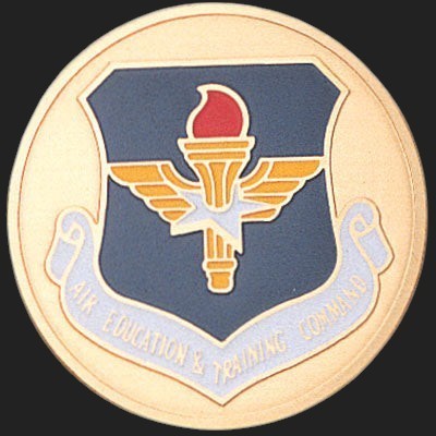 Metal Stickems 2-inch Air Education and Training Command metal emblem sticker with torch and wings insignia.