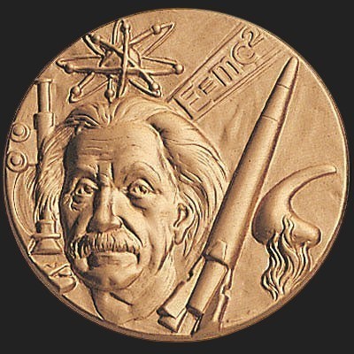 Metal Stickems Albert Einstein commemorative metal sticker featuring an embossed portrait and E=mc2 equation in bronze.