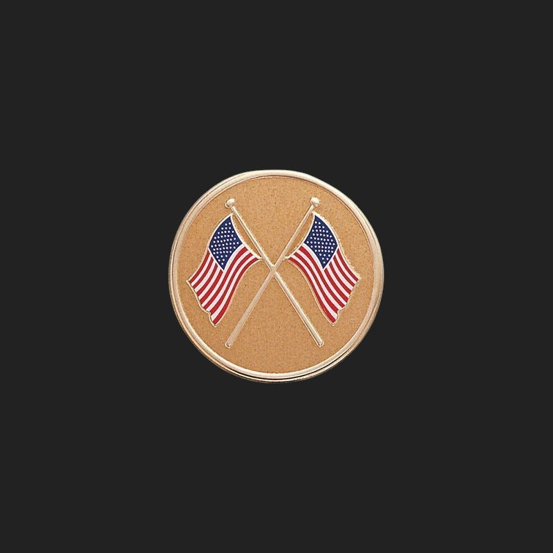 Metal Stickems American flag emblem featuring two crossed flags on a textured circular gold-tone metal background.