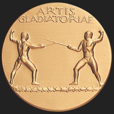 Metal Stickems 2-inch round gold metal sticker featuring an embossed gladiatorial combat scene and historical text.