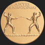 Metal Stickems 2-inch round gold metal sticker featuring an embossed gladiatorial combat scene and historical text.