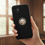 Metal Stickems 7/8 inch B.P.O.E. metal sticker with stag head and clock face on a black smartphone case