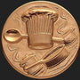 Metal Stickems 2-inch round bronze metal sticker featuring an embossed chef hat, spoon, and cooking pot design.