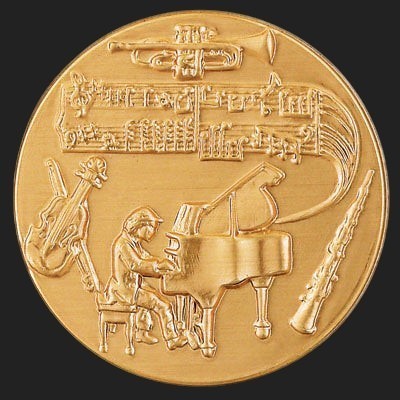 Metal Stickems 2-inch round gold-tone sticker featuring embossed classical instruments and musical notation.