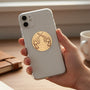 Metal Stickems crossed revolver metal sticker applied to the back of a smartphone case