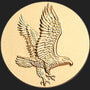 Metal Stickems 2-inch round gold metal sticker featuring an embossed eagle design for personalizing gear.