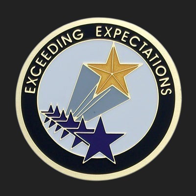 Metal Stickems 2-inch round metal sticker featuring a gold and blue star design with Exceeding Expectations text.
