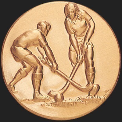 Metal Stickems 2-inch round gold-tone metal sticker featuring an embossed field hockey players action design.