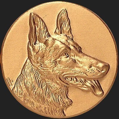Metal Stickems 2-inch round gold-toned metal sticker featuring an embossed German Shepherd dog portrait.