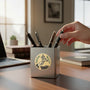 Metal Stickems 2-inch gold-toned metal sticker featuring a judge's gavel and laurel leaves on a desk pen holder.