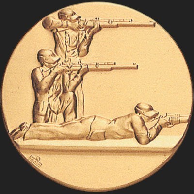 Metal Stickems gold-toned round commemorative marksman decal featuring embossed figures in shooting positions.