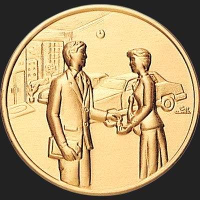 Metal Stickems 2-inch gold-tone adhesive medallion featuring an embossed professional business exchange scene.