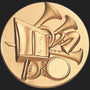 Metal Stickems gold-tone circular emblem featuring a raised-relief design of classic orchestral musical instruments.