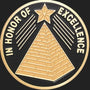 Metal Stickems 2-inch circular adhesive metal sticker with gold pyramid and star design on a black background.