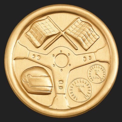 Metal Stickems 2-inch gold racing emblem with embossed steering wheel, helmet, checkered flags, and speed gauges.