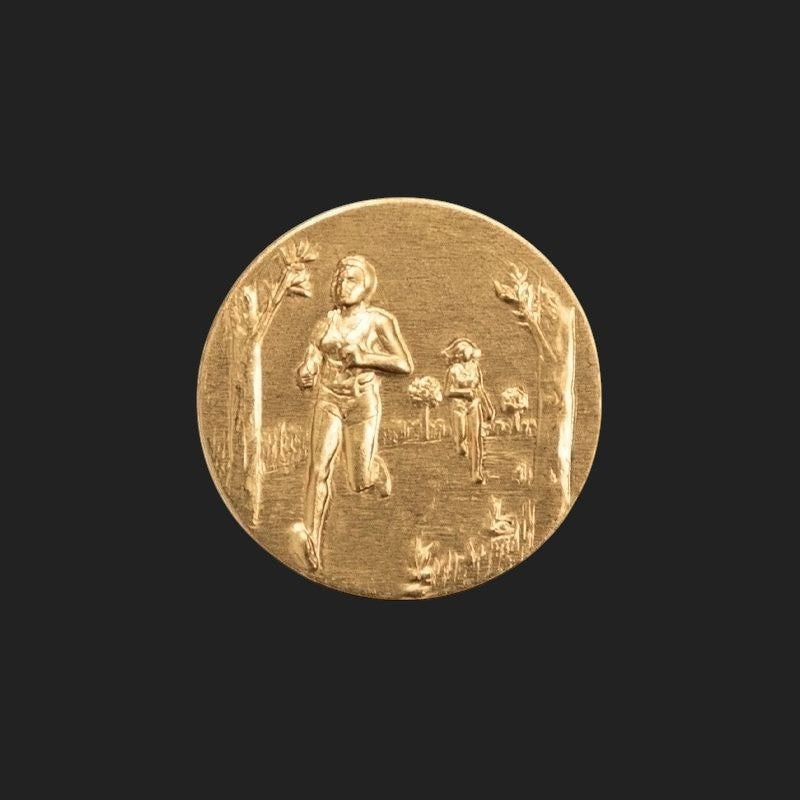 Metal Stickems 2-inch gold-tone embossed runner sticker featuring a detailed scene of athletes running outdoors.