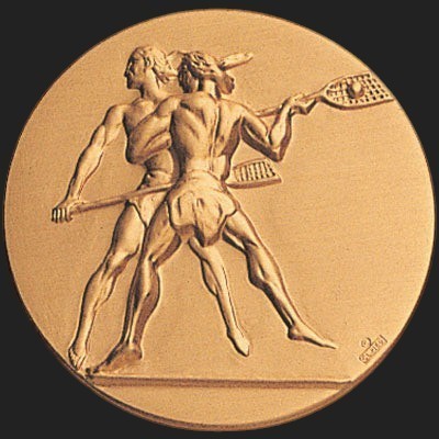 Metal Stickems 2-inch gold-tone adhesive sticker featuring an embossed design of two lacrosse players in action.