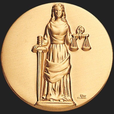 Metal Stickems Lady Justice 2-inch round gold-tone metal sticker with high-relief sword and scales design.