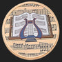 Metal Stickems 2-inch round metal sticker featuring a classic lyre instrument over musical sheet notation.