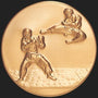 Metal Stickems 2-inch gold embossed martial arts sticker featuring raised-relief figures in a combat pose.
