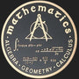 Metal Stickems 2-inch circular metal sticker with gold math equations and compass on a dark textured background.