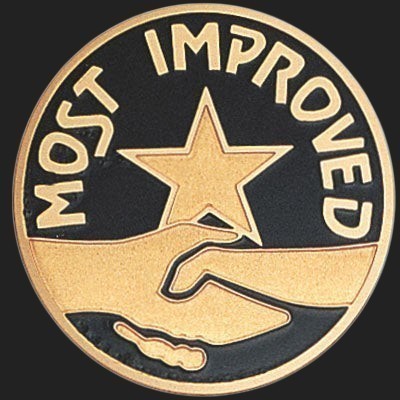 Metal Stickems 2-inch circular award sticker with gold handshake and star emblem on a black background.