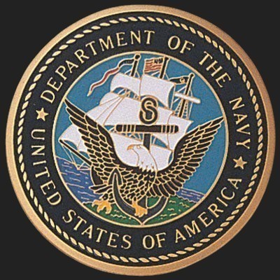 Metal Stickems 2-inch Department of the Navy metal emblem with official seal and gold trim on a black background.