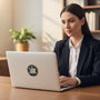 Metal Stickems 2-inch New York State Seal metal sticker applied to a laptop used by a woman in a professional office