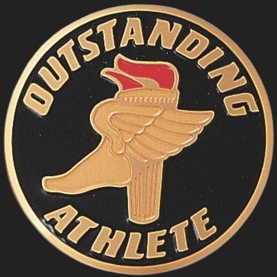 Metal Stickems 2-inch circular metal sticker with black background, gold lettering, and a winged-foot torch emblem.