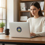 Metal Stickems Pennsylvania State Seal metal sticker applied to a laptop held by a woman in a home office setting.
