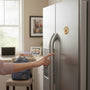 Metal Stickems 2-inch gold-tone Principal's Award sticker applied to a stainless steel refrigerator door