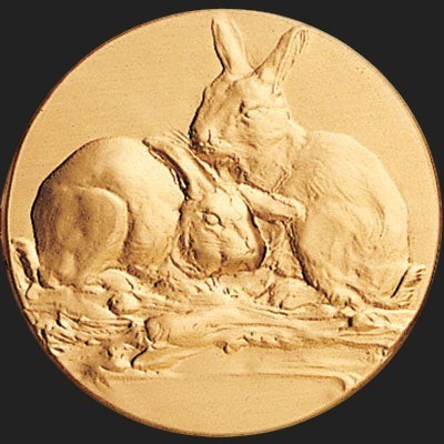 Metal Stickems 2-inch round adhesive medallion featuring an intricate embossed relief design of two rabbits in gold.
