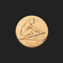 Metal Stickems 1-inch round adhesive sticker featuring an embossed gold-toned rowing athlete in motion.