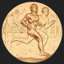 Metal Stickems 2-inch gold-tone adhesive medallion featuring a detailed relief design of runners in motion.
