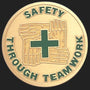Metal Stickems 2-inch round gold metal sticker with green embossed hands and cross safety teamwork design.