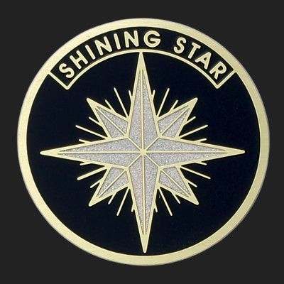 Metal Stickems 2-inch round metal sticker featuring a black background and a textured silver shining star emblem.