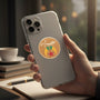 Metal Stickems 2-inch Shriners metal emblem with enamel detail applied to the back of a smartphone held in a hand.