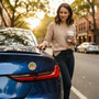 Metal Stickems United States Space Force gold metal emblem sticker applied to the trunk of a blue car.