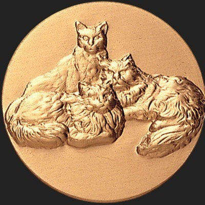 Metal Stickems round adhesive emblem featuring a detailed raised relief design of three resting cats in a gold finish.