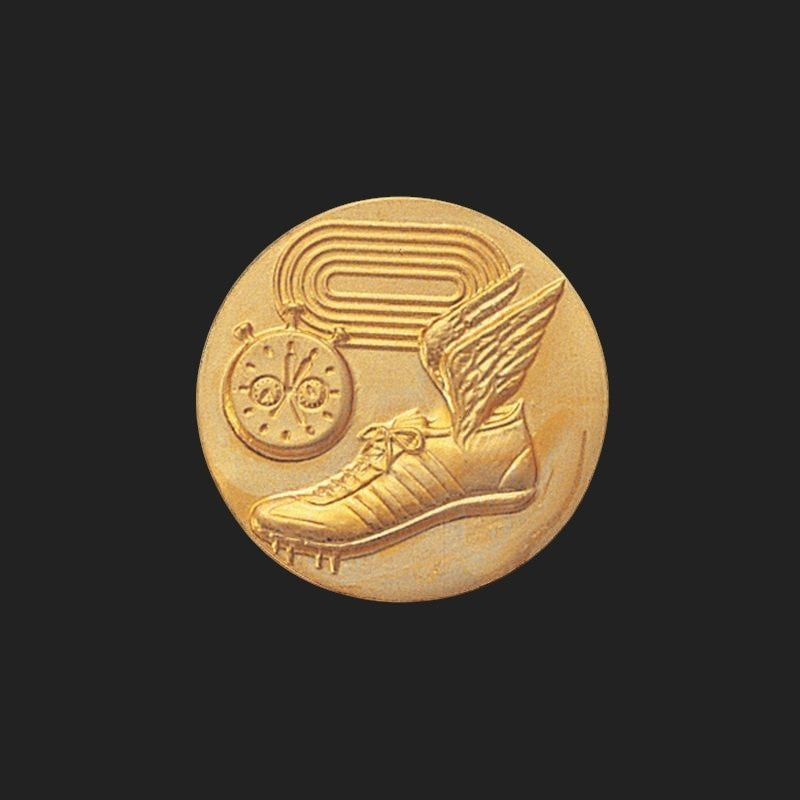 Metal Stickems 1-inch gold-tone track and field achievement sticker with raised running shoe and stopwatch design.
