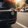 Metal Stickems 2-inch United States Army metal emblem sticker applied to the bumper of a black car