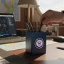 Metal Stickems United States Navy metal emblem sticker featuring the official seal on a blue desk pen holder.