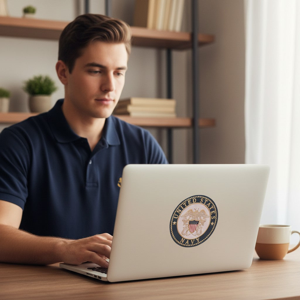 Man using a laptop with a 4-inch Metal Stickems United States Navy emblem sticker applied to the lid.