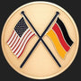 Metal Stickems 2-inch round adhesive emblem featuring crossed USA and Germany flags in a gold metallic finish.