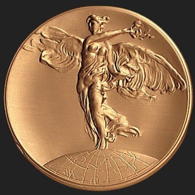 Metal Stickems 2-inch circular metal sticker featuring a high-relief Winged Victory design in a bronze metallic finish.